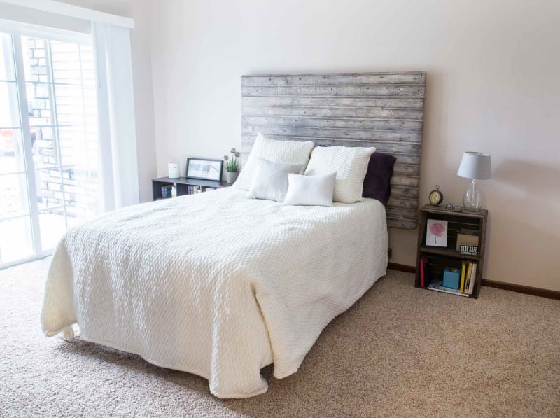 Bedroom with access to the balcony at Ironwood in Altoona, Iowa