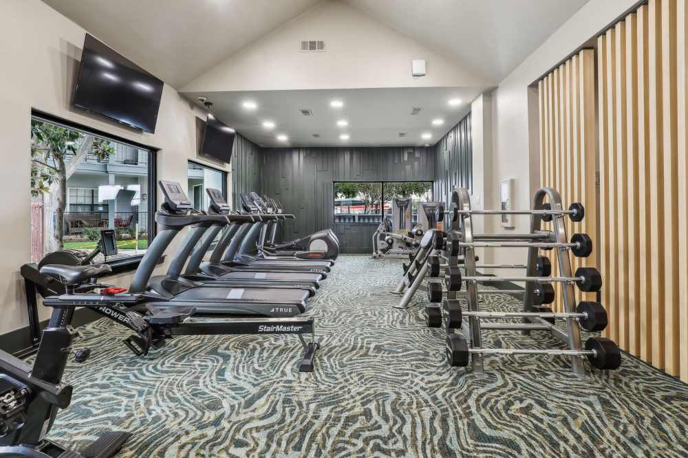 Fitness center with tv at Vail Cliffside in Arlington. TX