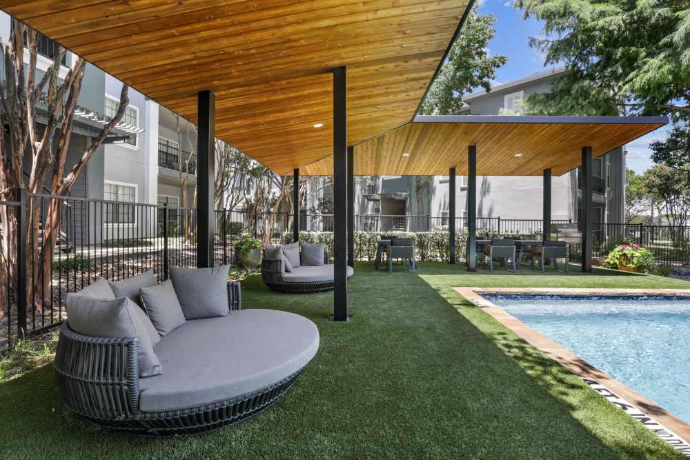 View of pool area with cabana and patio at Vail Cliffside in Arlington. TX