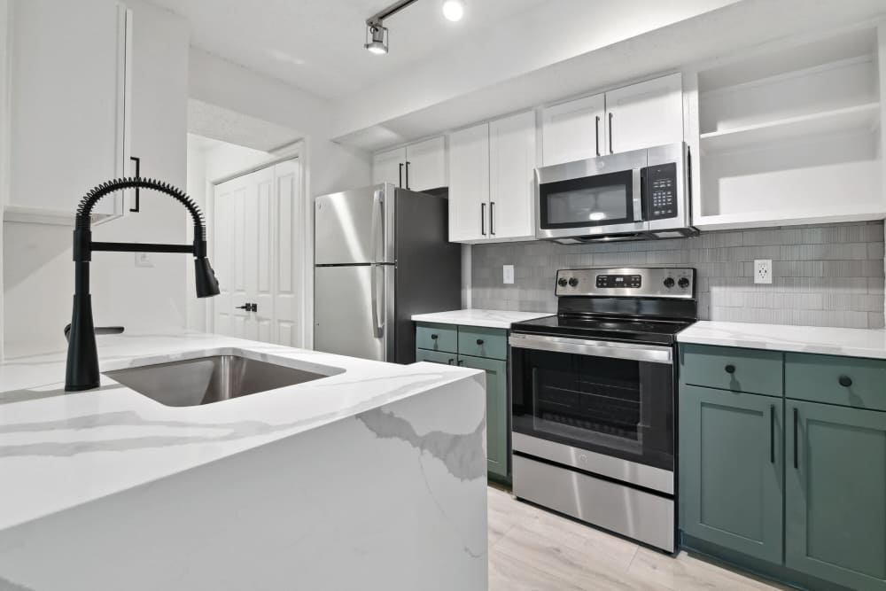 View of kitchen with water sink at Vail Cliffside in Arlington. TX