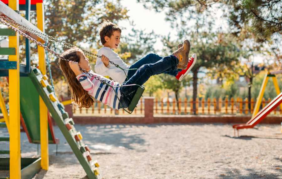 Kids playing on swing at Emerald Place in Lancaster, Ohio