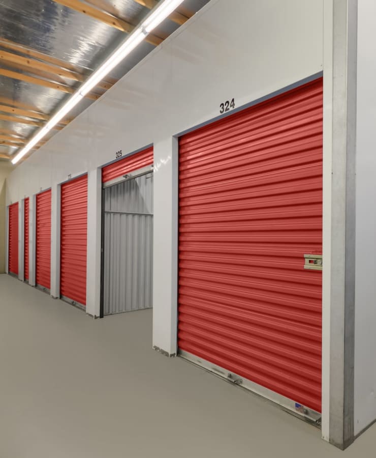 Indoor self storage units with red doors at StorQuest Self Storage in Vallejo, California