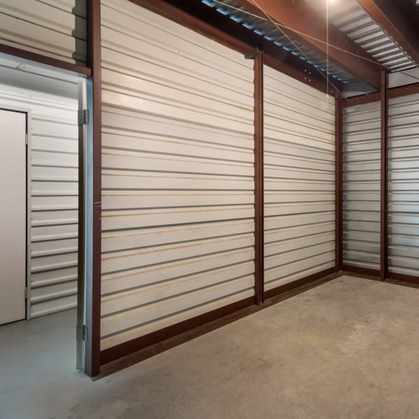 Inside a large indoor storage unit at StorQuest Self Storage in Arlington, Texas