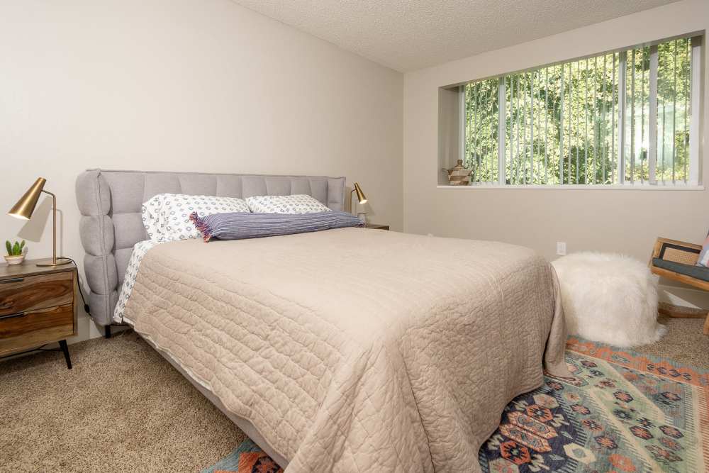 Furnished bedroom in model home at  The Marq in Santa Rosa, California