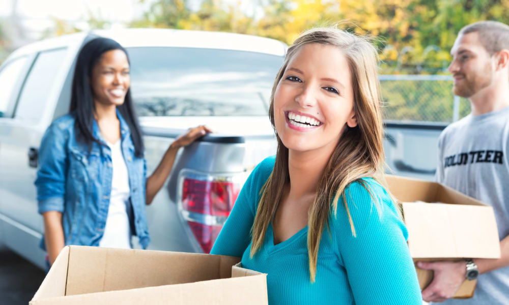 Friends moving boxes at The Storage Bunker in Medford, Massachusetts
