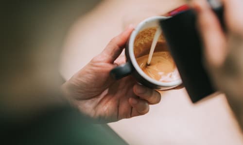 Pouring coffee near Sycamore Commons Apartments in Fremont, California