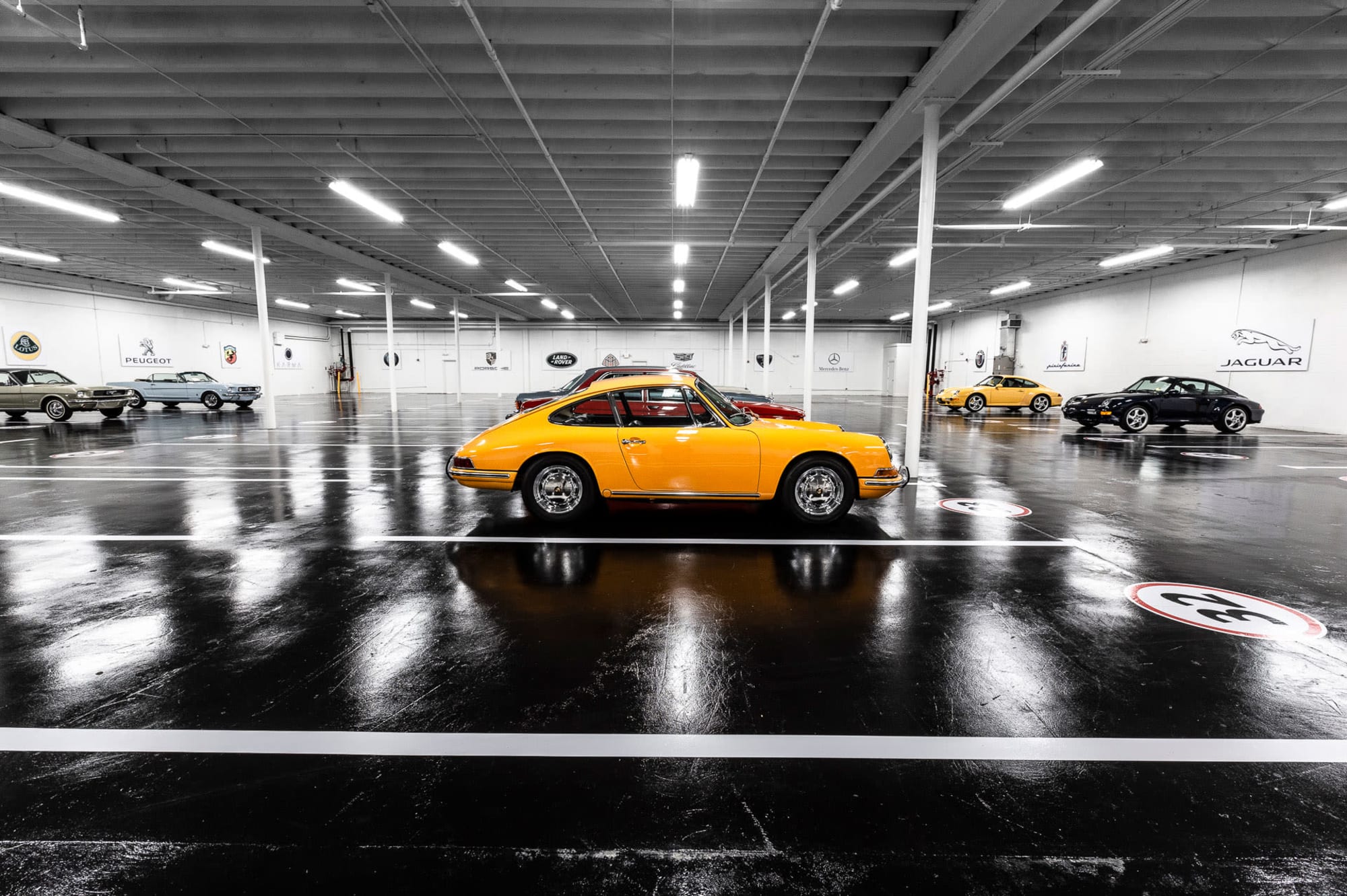 The profile of a yellow Porsche sports car, stored at Premier Car Storage