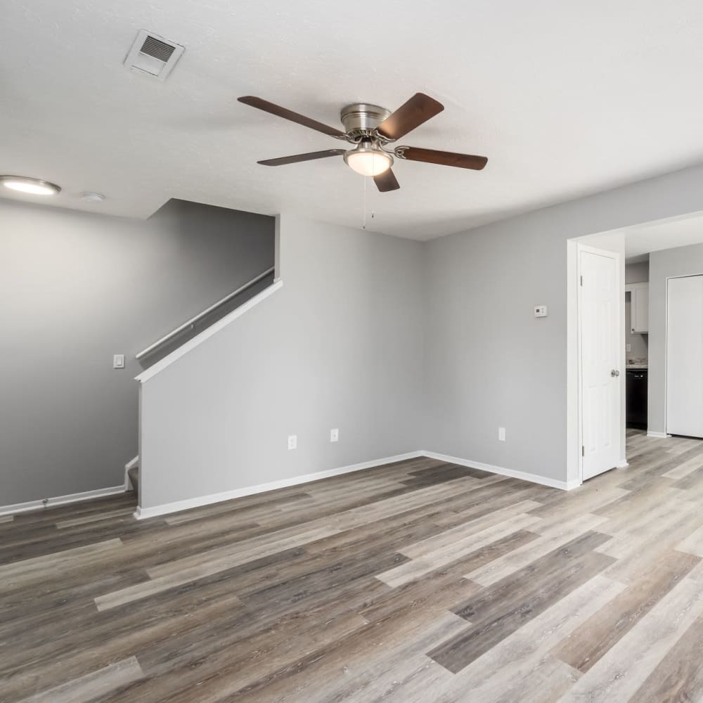 Living room with staircase at Hidden Acres East in Columbus, Ohio