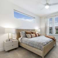Bedroom with a cozy bed at Slide North Apartments in Lubbock, Texas