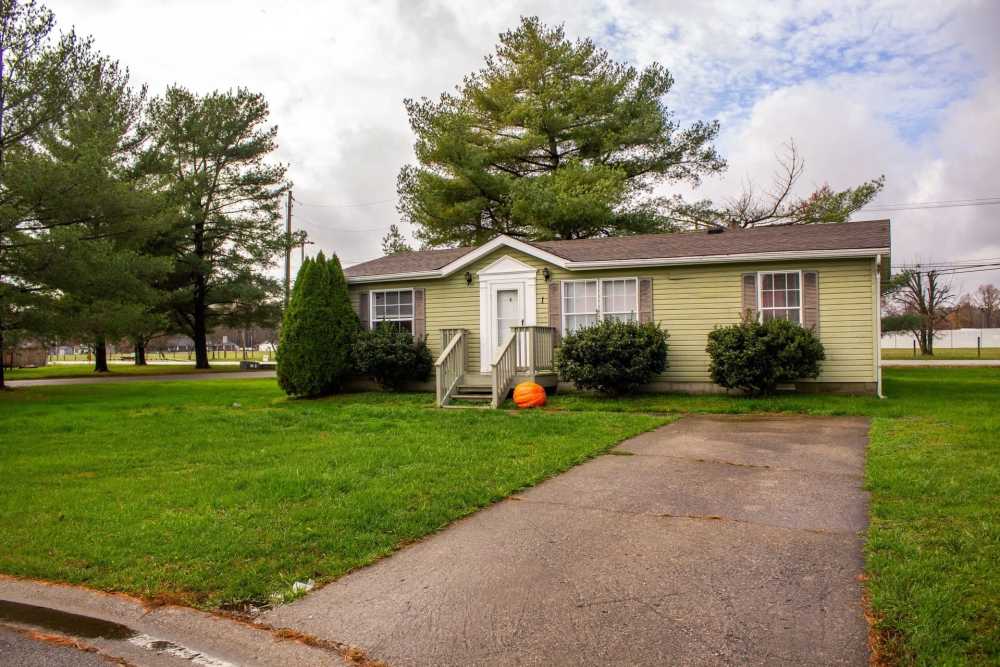 Lush green pathway to the apartment house at Fairview Crossing in Scottsburg, Indiana