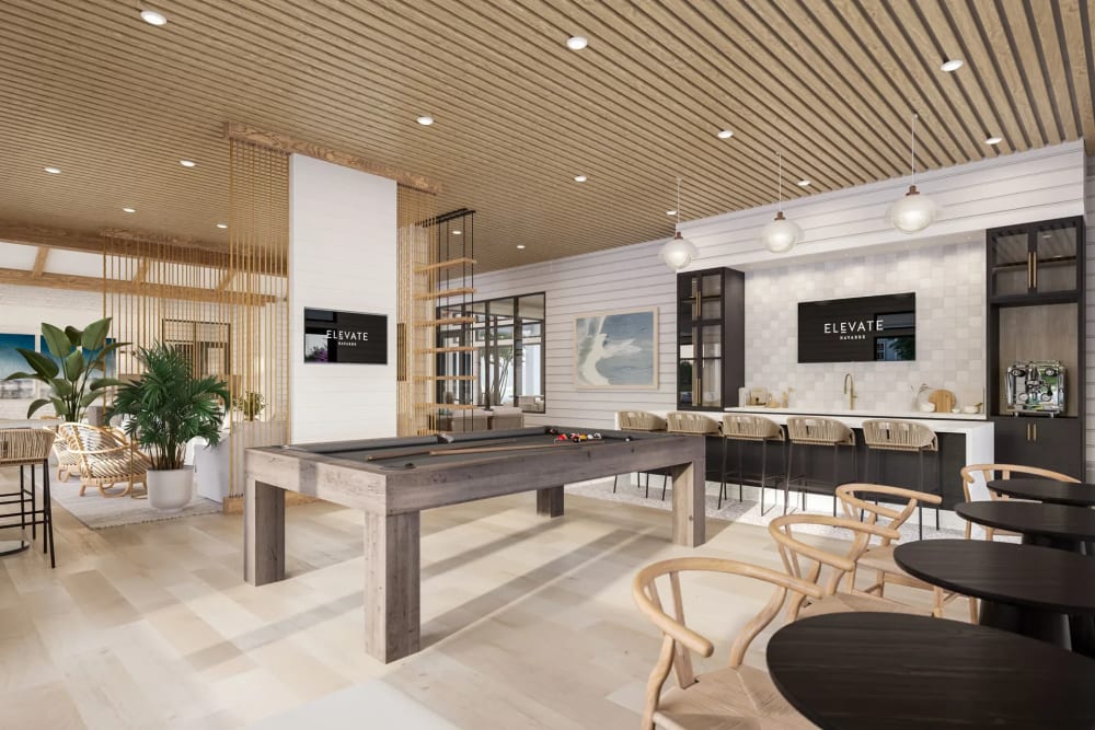 Clubhouse with billiard table and bar at Elevate Navarre in Navarre, Florida