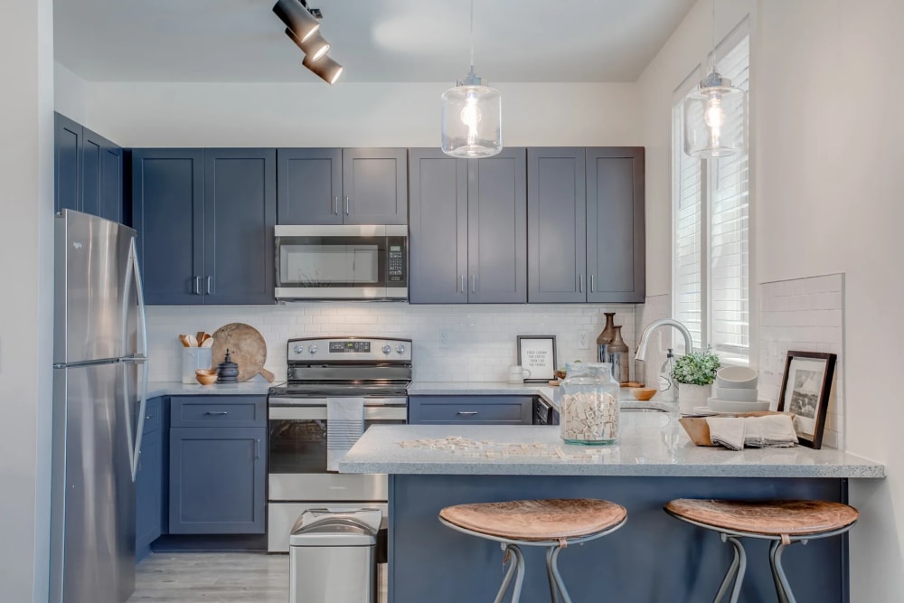 Kitchen with stainless-steel appliances at Premiere Lofts at Trilith, Fayetteville, Georgia