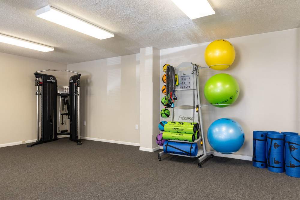 Fitness center with exercise ball and other equipments at West Village Apartments in Hillsborough, North Carolina