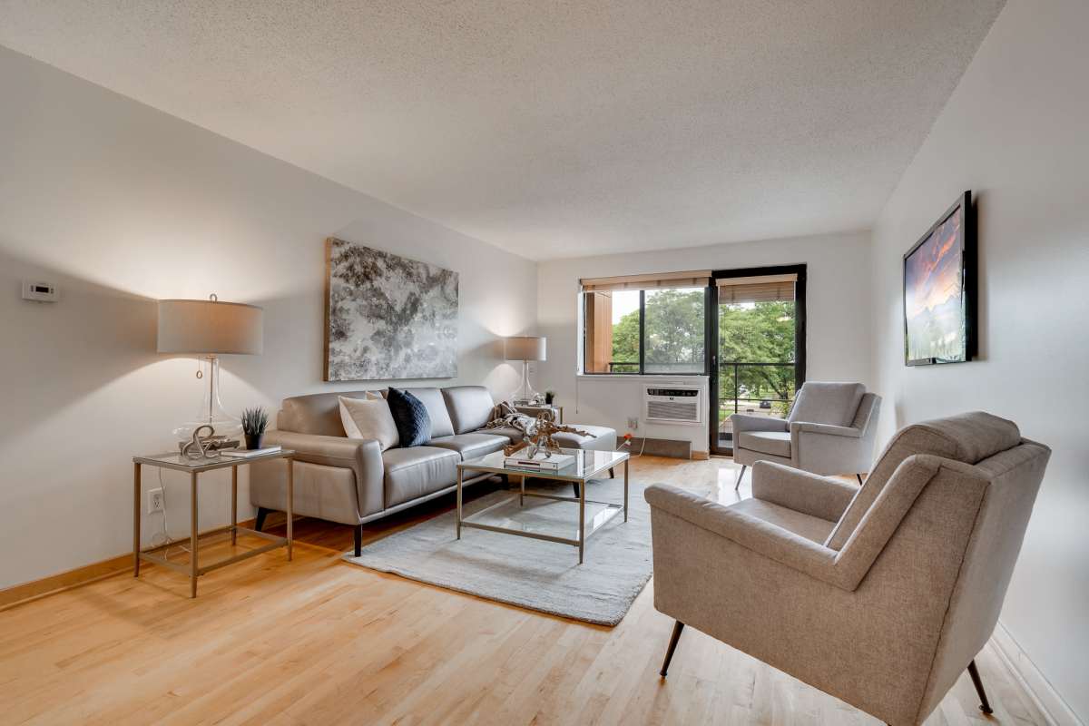 Upgraded living room with wood-style flooring at 311 Kenwood Parkway in Minneapolis, Minnesota