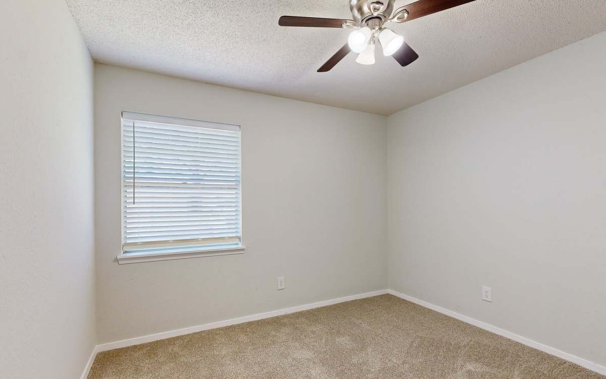 Unfurnished bedroom with carpet flooring at Wynwood at Fairhope in Fairhope, Alabama