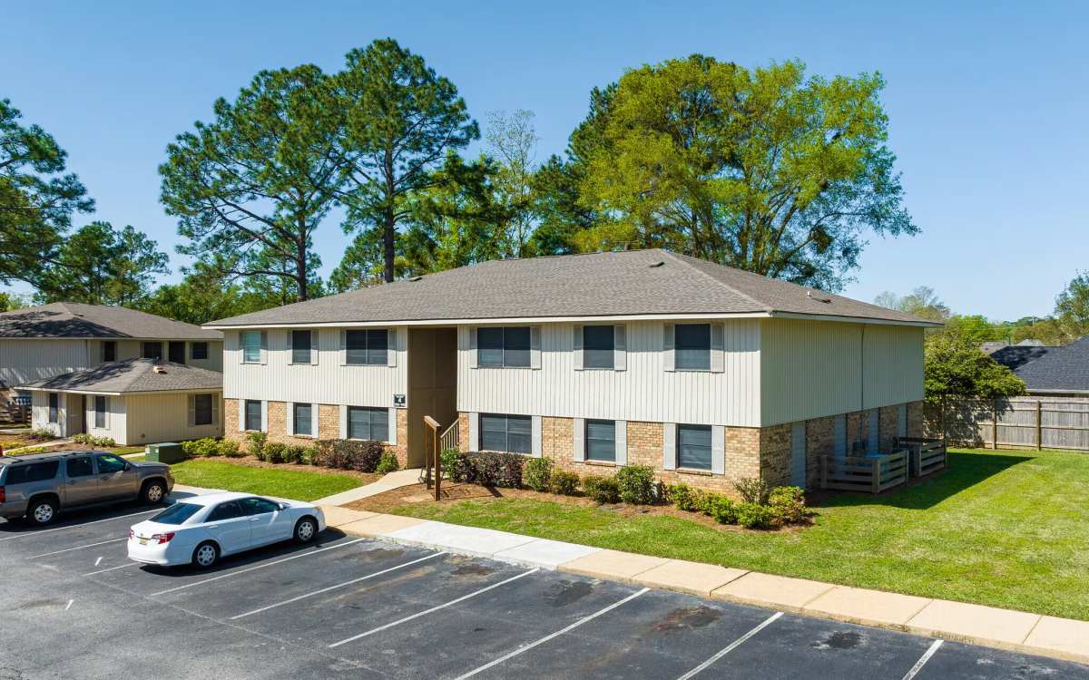 Exterior view of the apartment with parking lots at Wynwood at Fairhope in Fairhope, Alabama