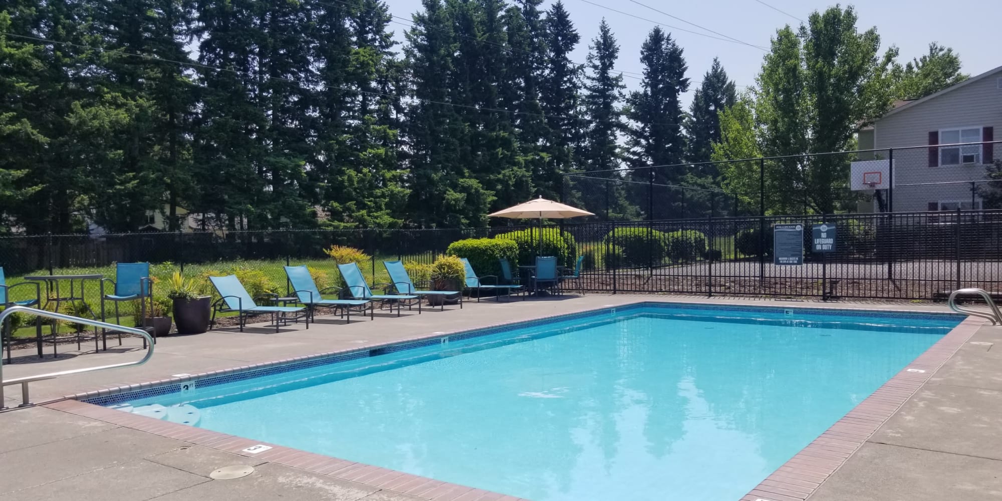 beautiful pool view with lounge chairs in Gresham, OR