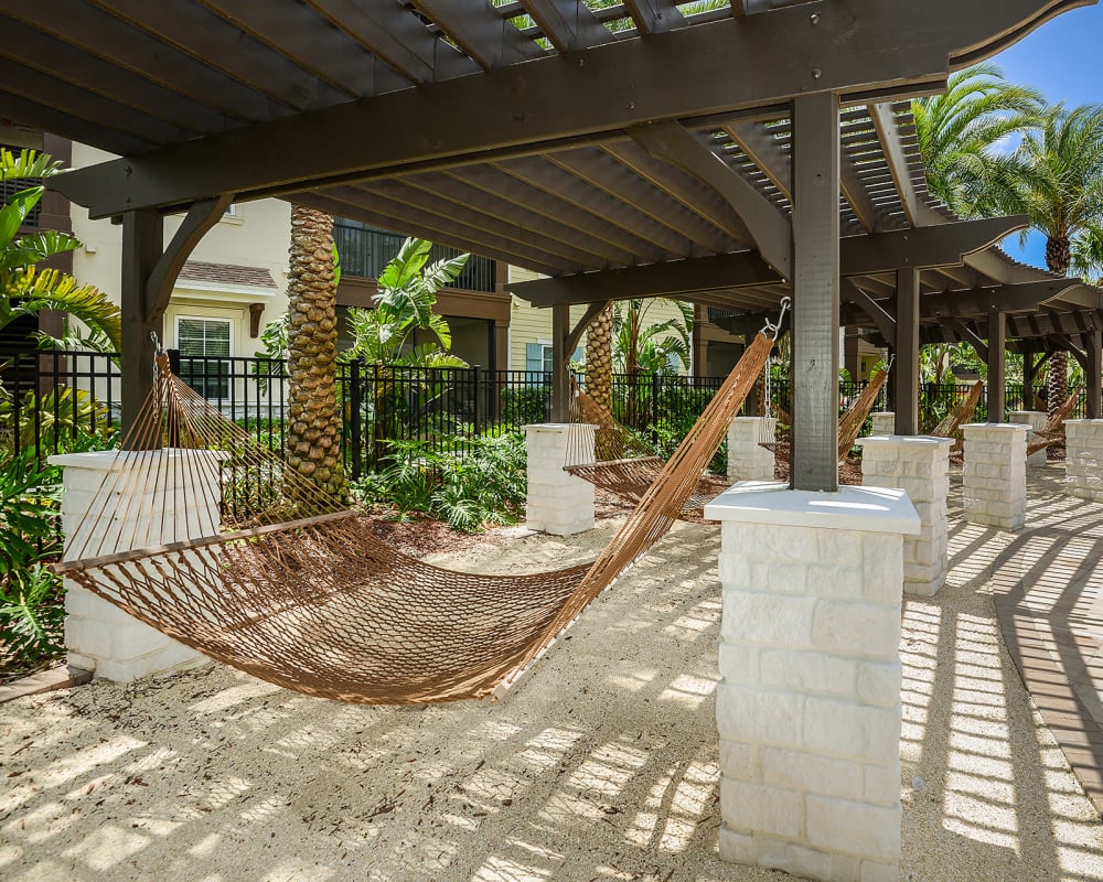 Hammock hung between posts under a pergola at Cabana Club and Galleria Club in Jacksonville, Florida
