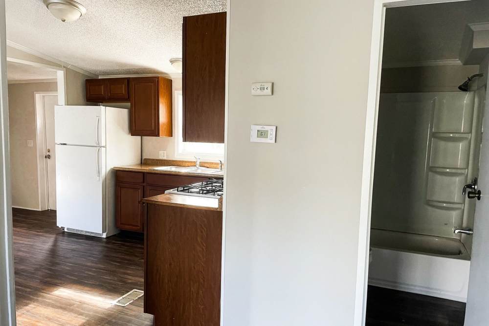 Kitchen view and the bathroom with bathtub at Fairview Crossing in Scottsburg, Indiana