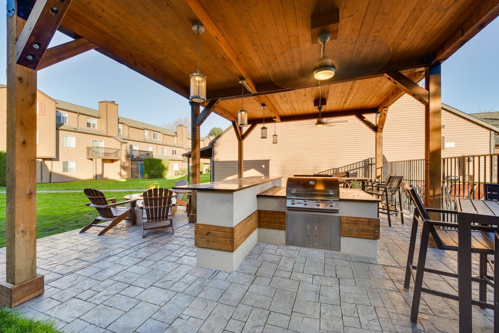 Covered grill and fire pit area at Renaissance at 29th Apartments in Vancouver, Washington