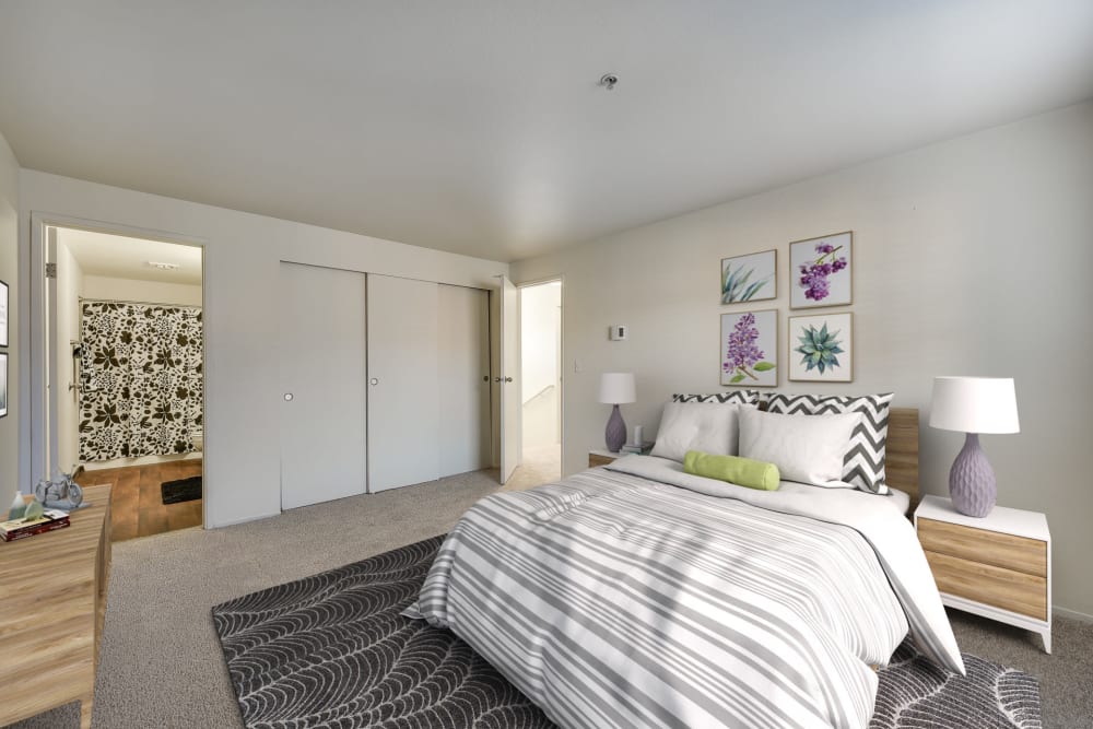 Decorated master bedroom with a large closet at Renaissance at 29th Apartments in Vancouver, Washington