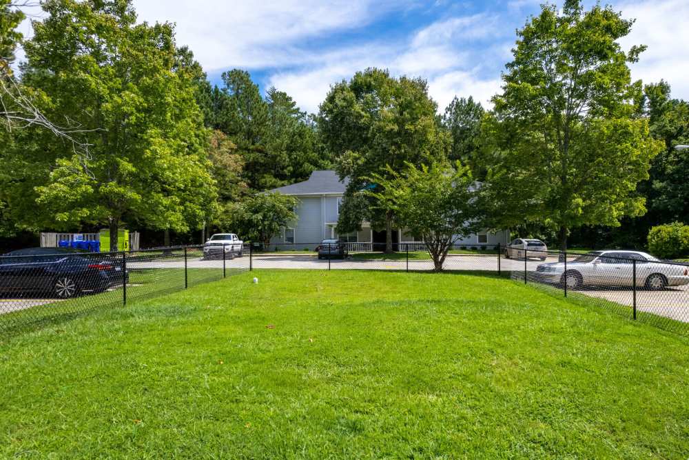 Fenced community dog park at West Village Apartments in Hillsborough, North Carolina