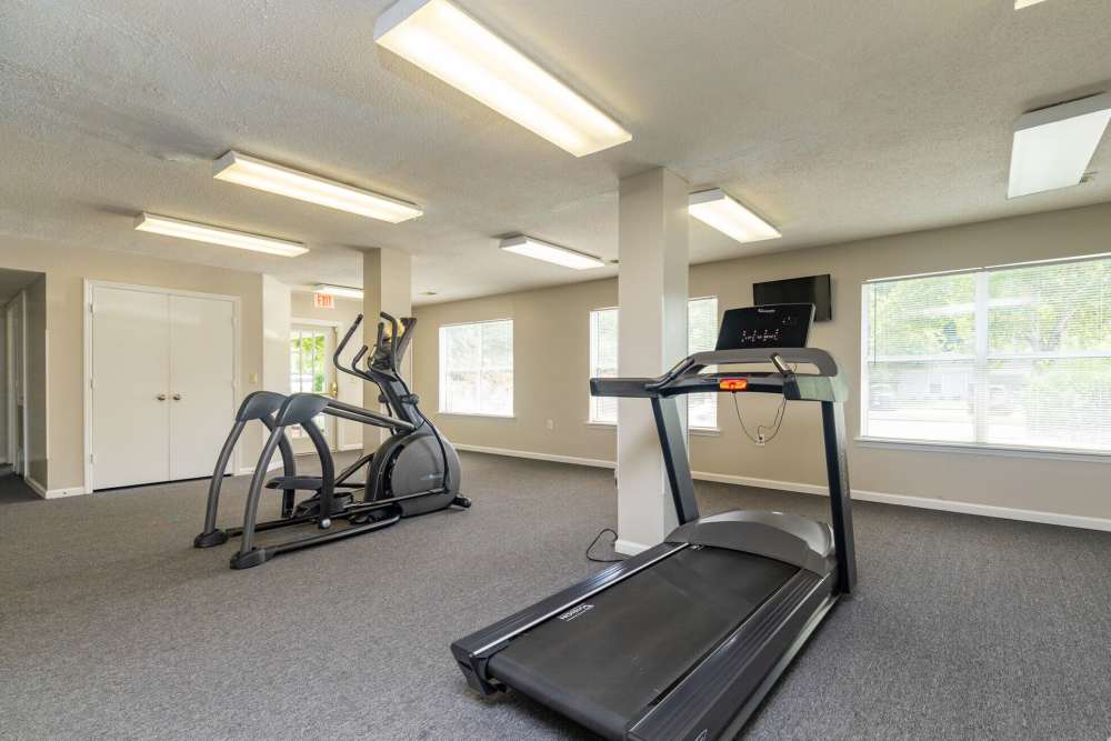 Fitness center with treadmill and cyclying at West Village Apartments in Hillsborough, North Carolina