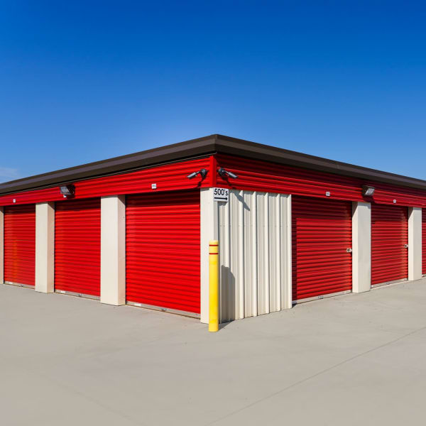 Large drive-up storage units with red doors at StorQuest Express Self Service Storage in Sonora, California