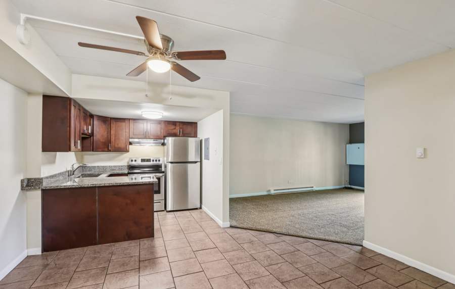 Apartment kitchen with refrigerator at Regents Park Apartments in Bensenville, Illinois