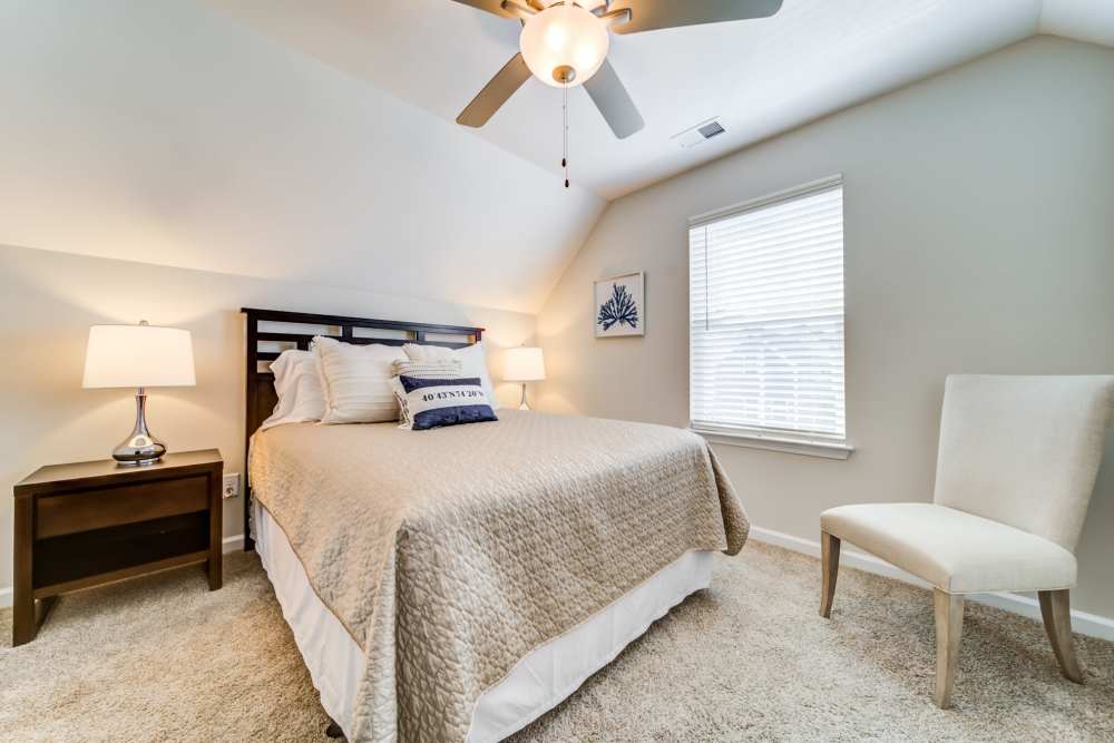 Modern bedroom with a window at Seaglass Cottage in North Myrtle Beach, South Carolina