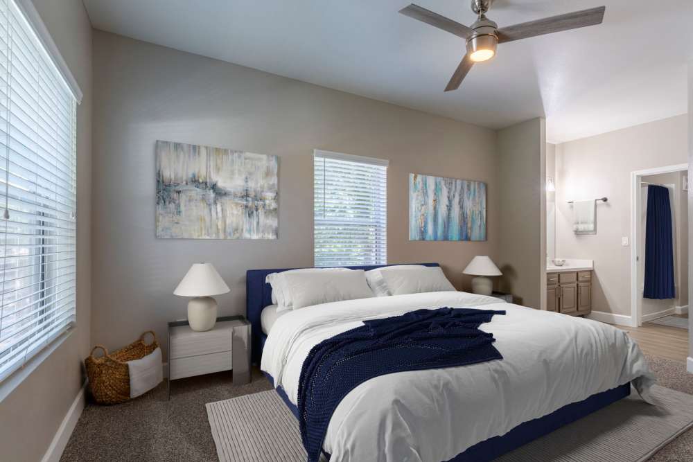Modern bedroom with blue accents at Canyon Vista in Sparks, Nevada
