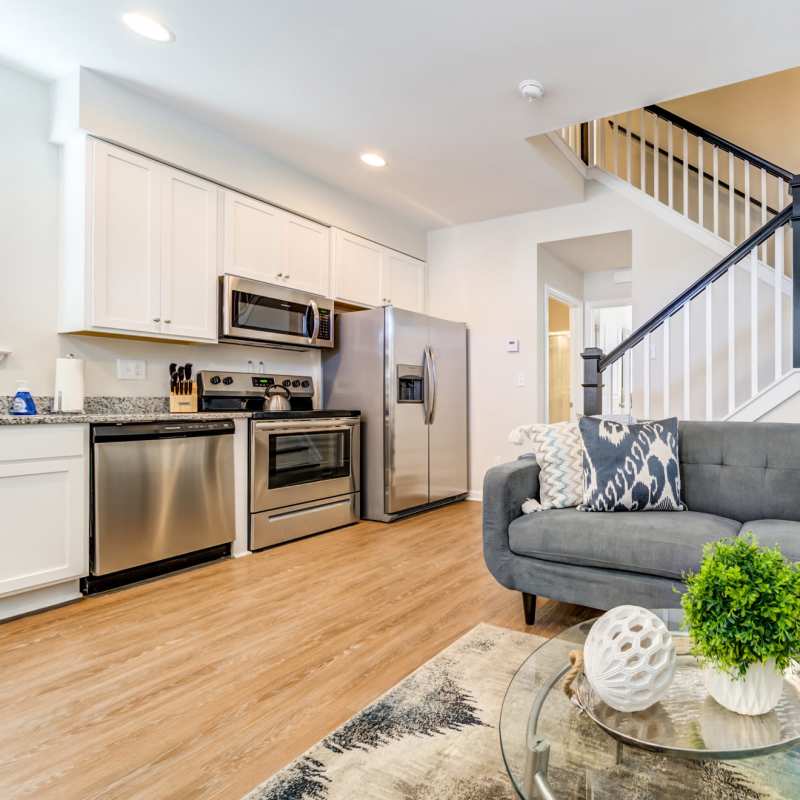 Modern kitchen with connecting living room at Seaglass Cottage in North Myrtle Beach, South Carolina