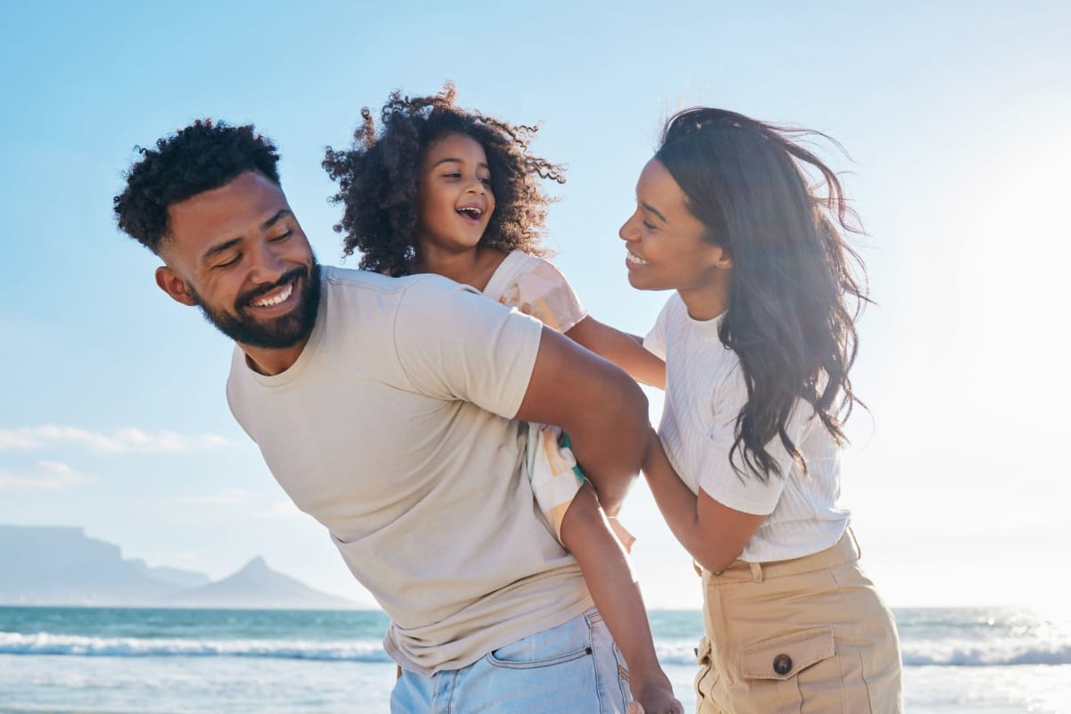 A family enjoys some beach time near Bay on 6th, Santa Monica, California