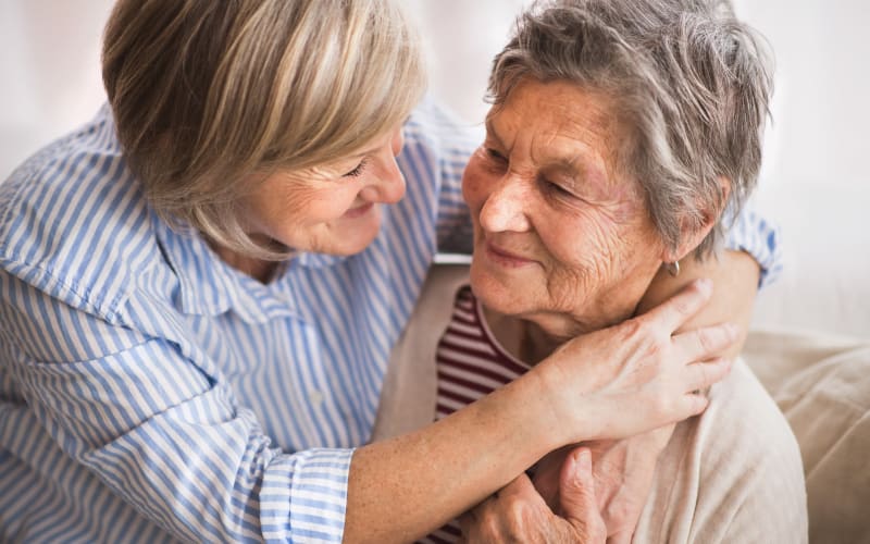 A mother and daughter hugging at Heritage Senior Living in Blue Bell, Pennsylvania