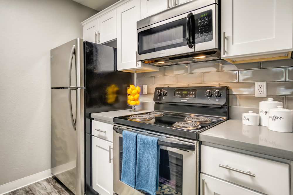 A kitchen, with tile backsplash at Serramonte Ridge Apartment Homes in Daly City, California