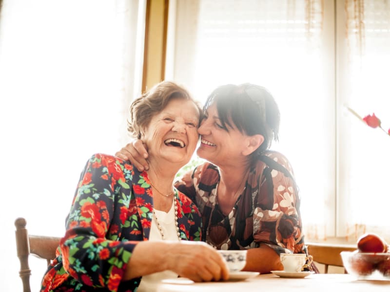 Resident and daughter having fun during visiting hours at Geneva Lake Manor in Lake Geneva, Wisconsin