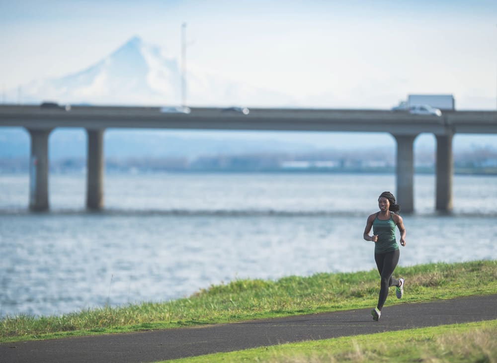 A women on a jog along the waterfront near The Columbia at the Waterfront in Vancouver, Washington