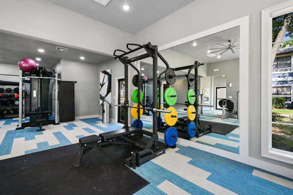 Strength-training equipment in the fitness center at Seacrest in Katy, Texas