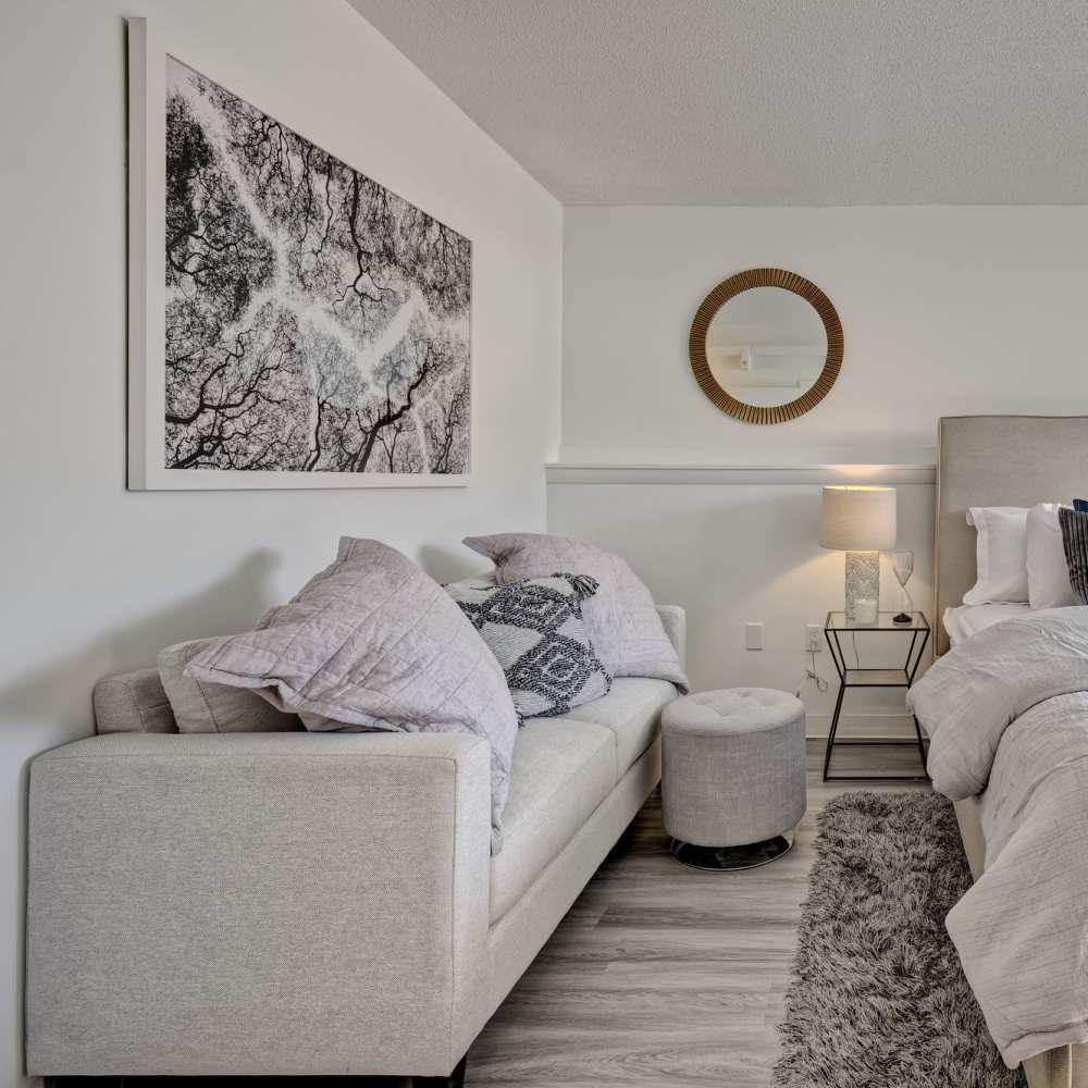 Comfortable sofa in the bedroom at The Otis in Dallas, Texas