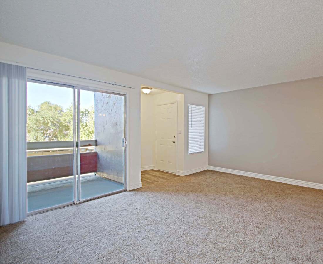 Apartment room with plush carpet flooring at 544 Southern Apartments in Mesa, Arizona