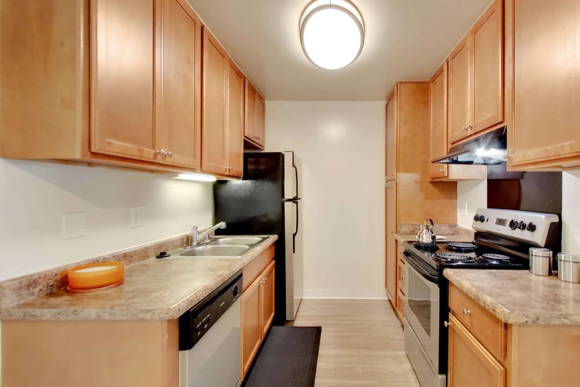 Kitchen with stainless steel appliances at Lakeside Village in San Leandro, California