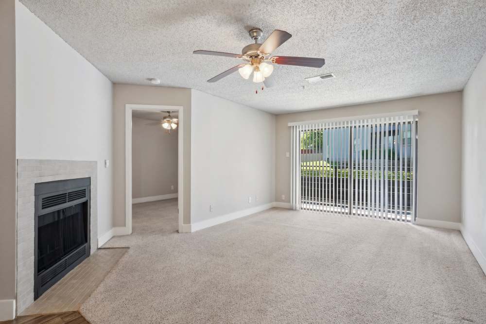 Unfurnished living room with fireplace at Halston in Dallas, Texas