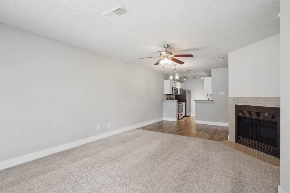 Unfurnished living room with view of kitchen at Halston in Dallas, Texas