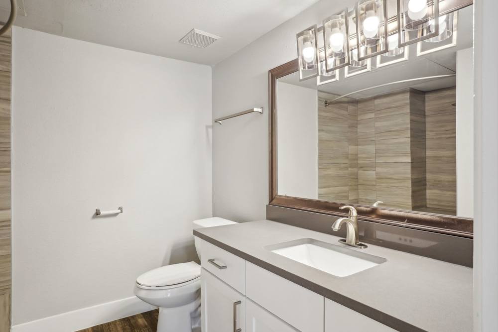 Bathroom with vanity and bathtub at Halston in Dallas, Texas