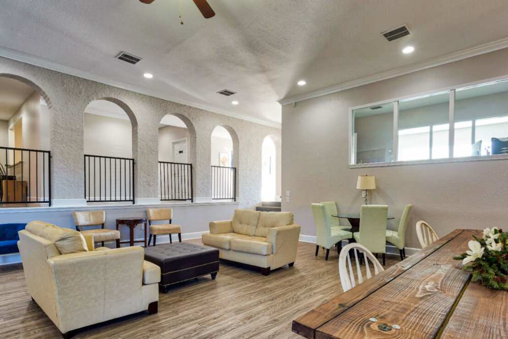 Community clubhouse with large couch and chairs at Lake Hefner Townhomes in Oklahoma City, Oklahoma