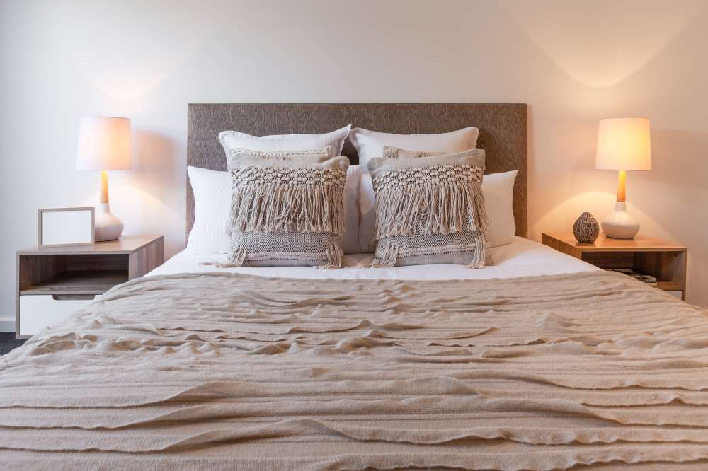 A luxurious bed in a bedroom at The Flats at Talcott in Weatogue, Connecticut