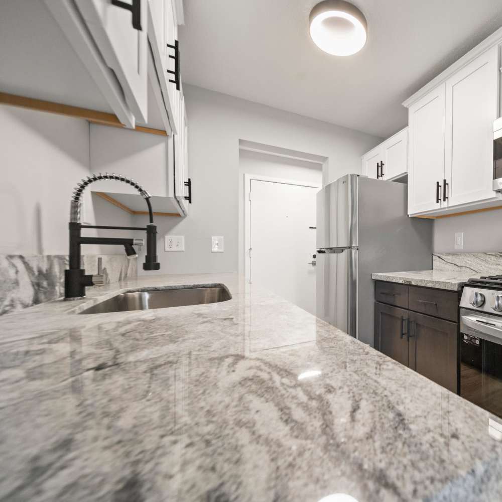 Granite counters and white cabinets at Morada in Crystal, Minnesota