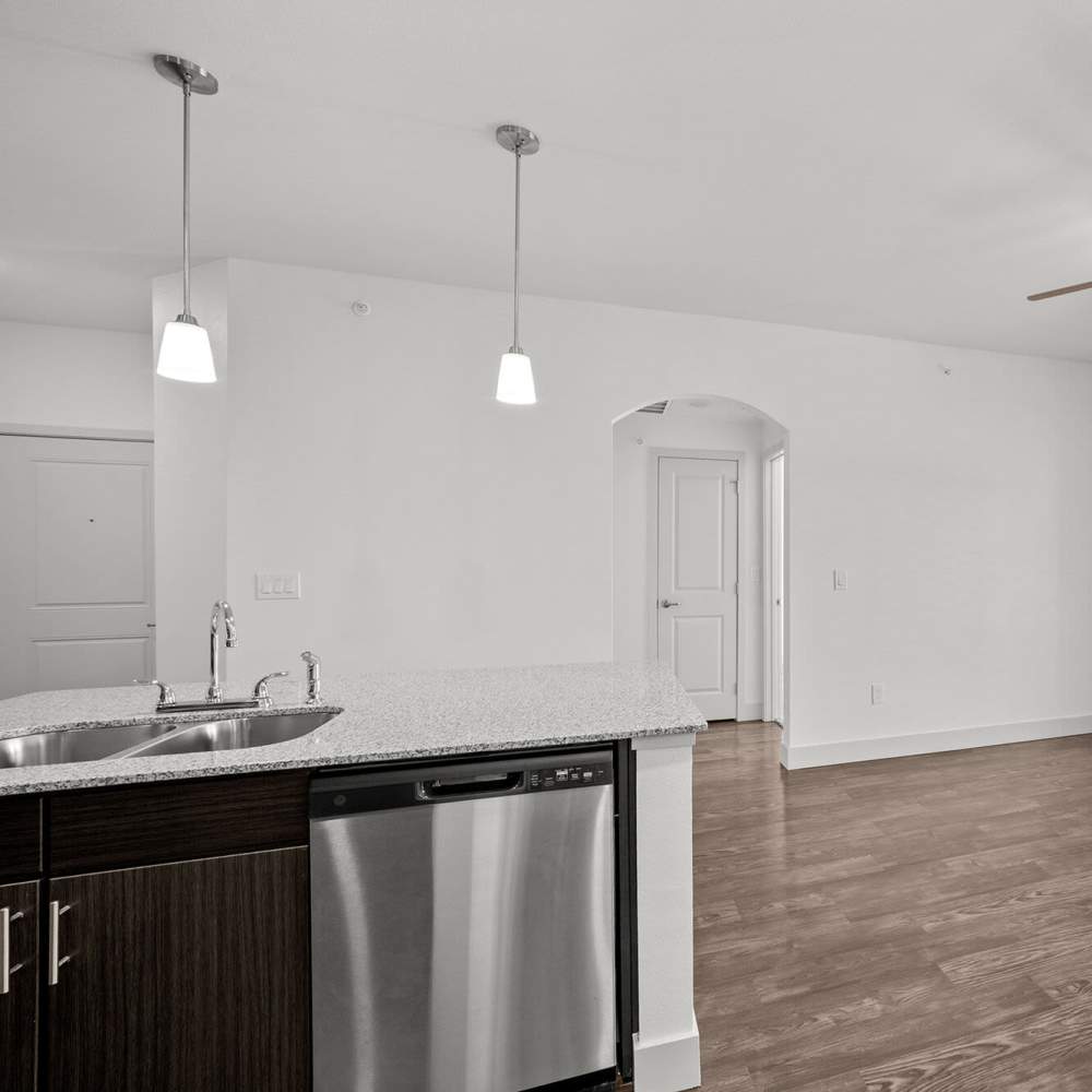 Kitchen with access to patio through glassdoor at Brook Hollow in Wichita Falls, Texas