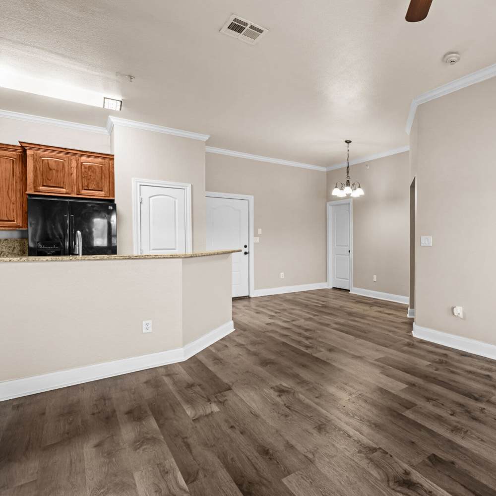 Living room with close access to kitchen at The Arbors of Mineola in Mineola. TX