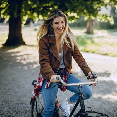 Resident riding a bike nearby The Residences at Creighton Waterway in North Port, Florida